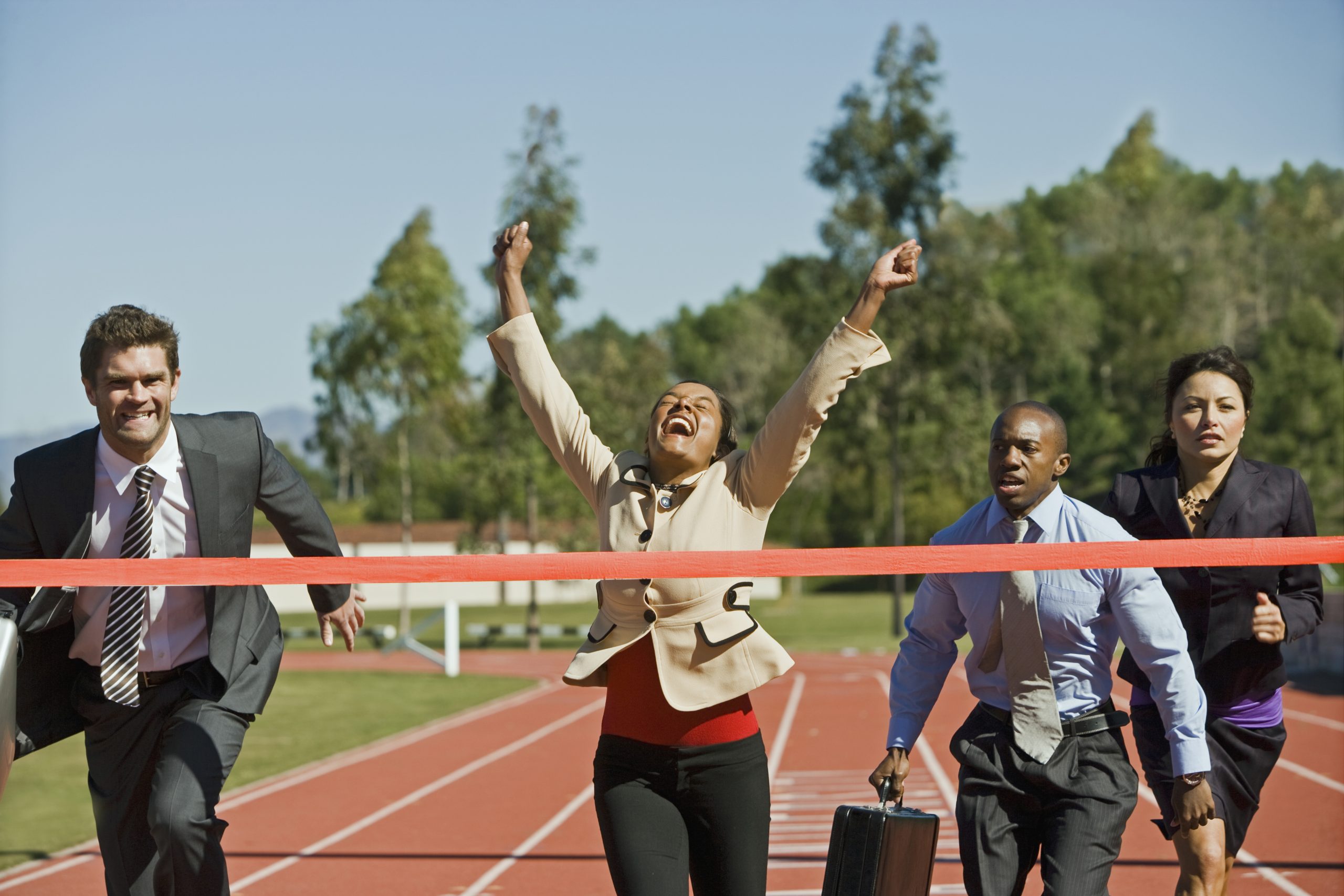 Business people running on track