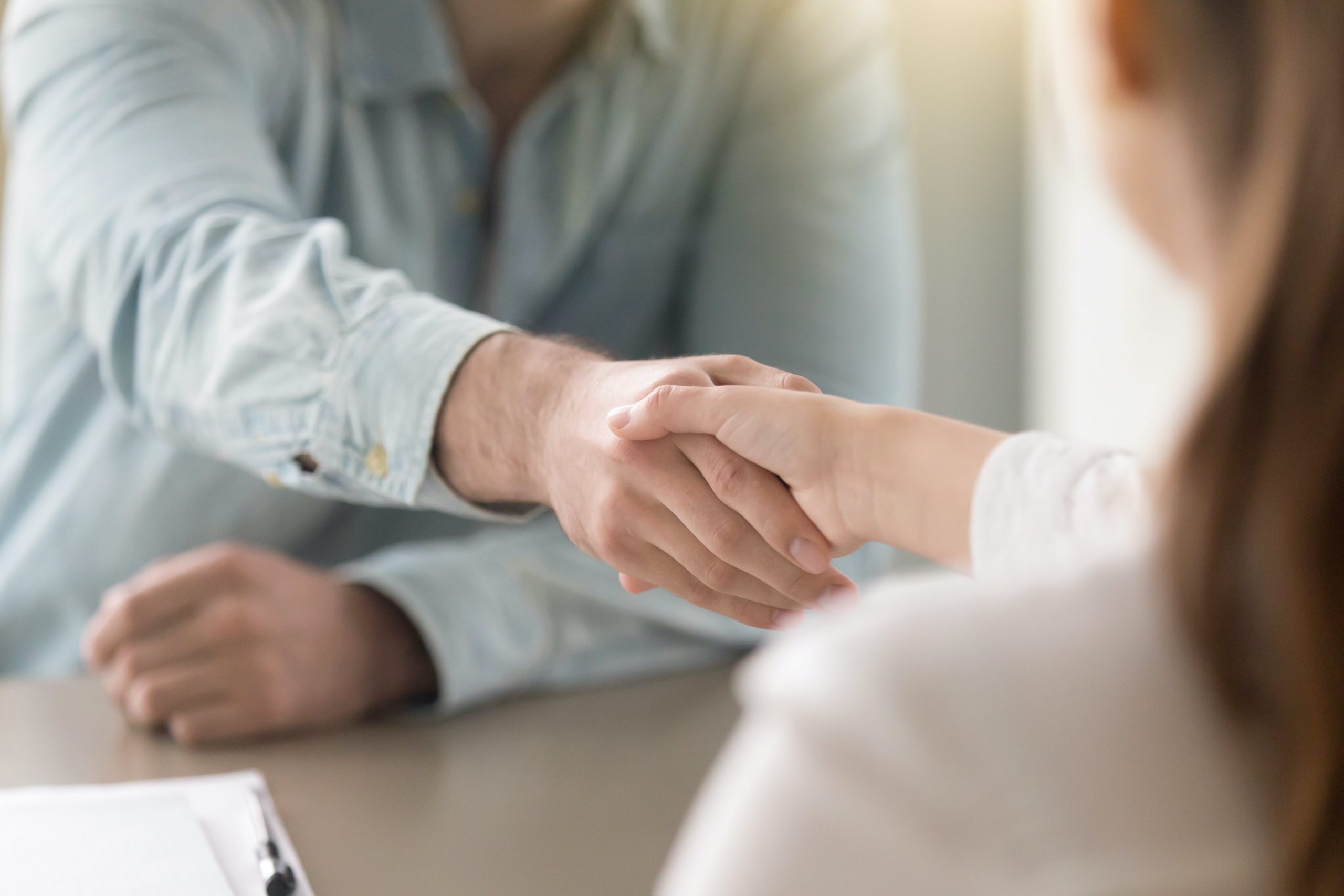 Businessman shaking businesswoman's hand